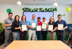 Golf professionals receiving the Sally Burns Rambo Scholarship awards at a ceremony.